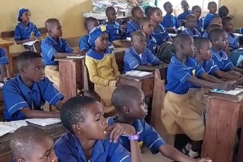 A full classroom of children in school uniform at their desks in Lagos – African Talents Foundation
